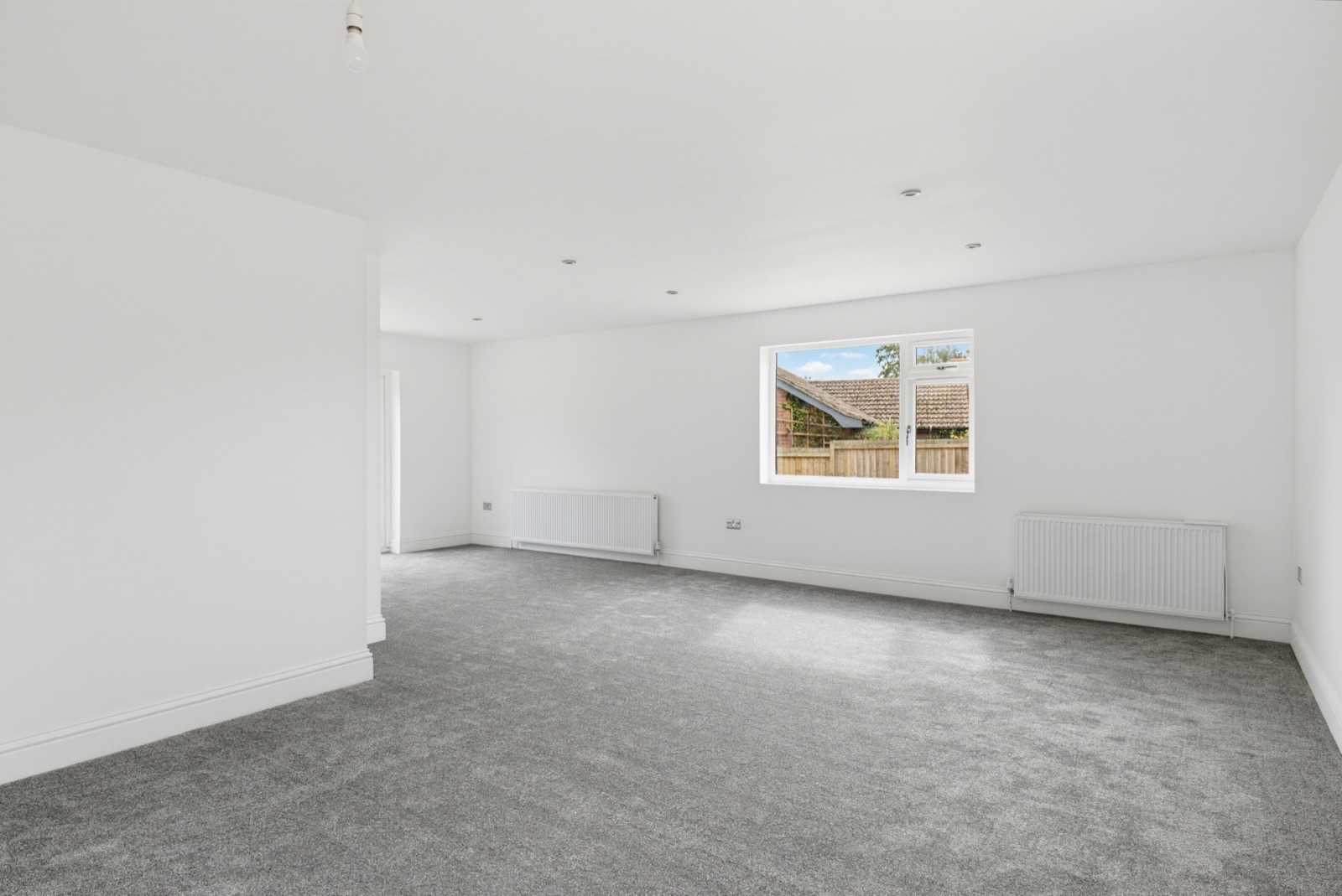Unfurnished reception room with a garden-facing window
