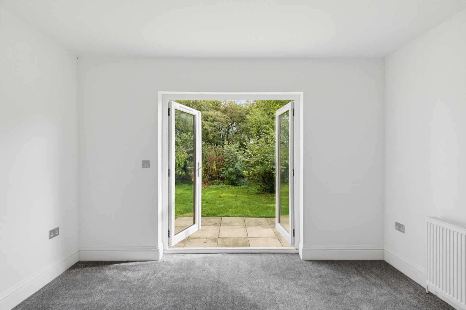 Reception room with French doors open onto the patio