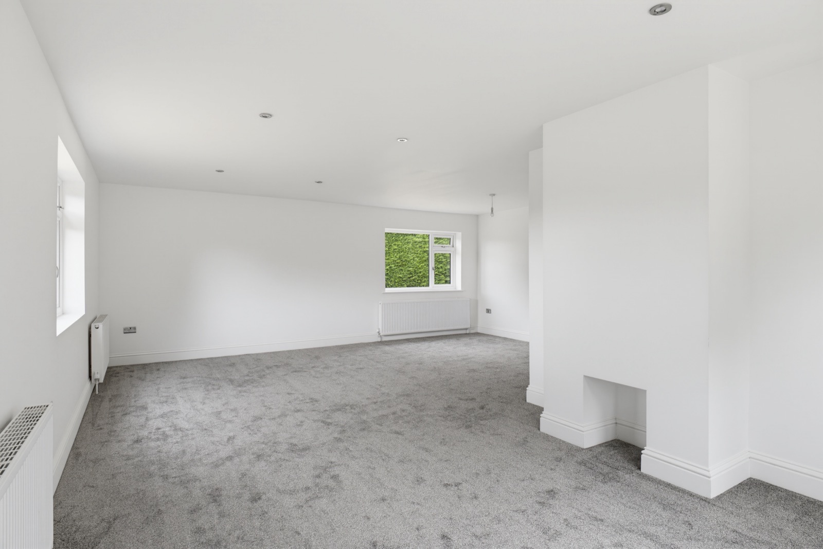 Living room with a chimney breast alcove