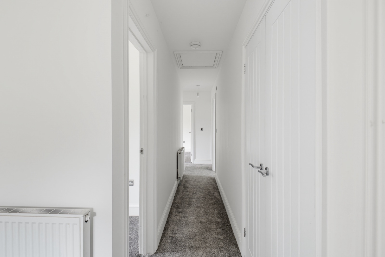 Carpeted hallway landing